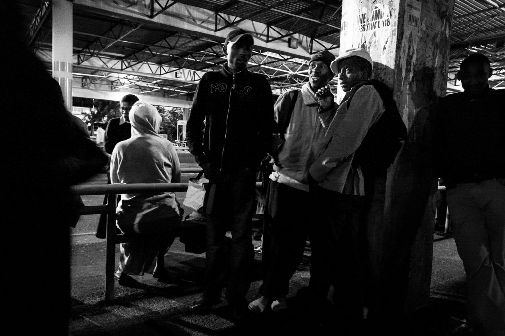 Young workers commuting via the central bus terminus, Cape Town, 2010.
