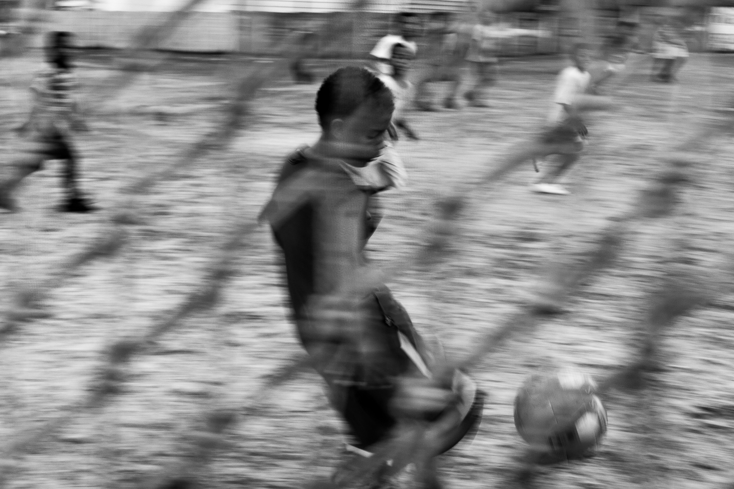 Children playing football on a community field, Mitchell’s Plain, 2011.