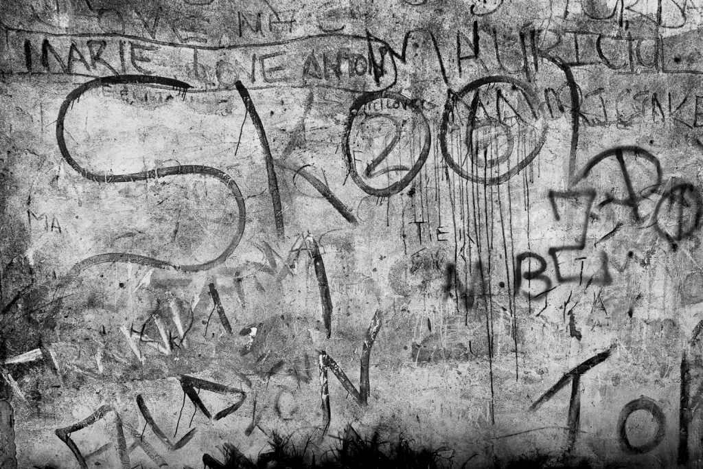 Detail of wall with the word “Skool” and gang related tags, Mitchell’s Plain, 2013.