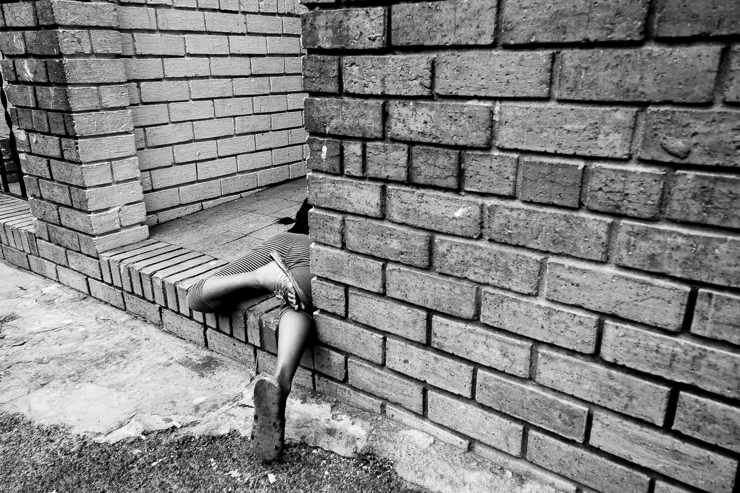 Child playing in the front yard of her home, Salt River, 2011.