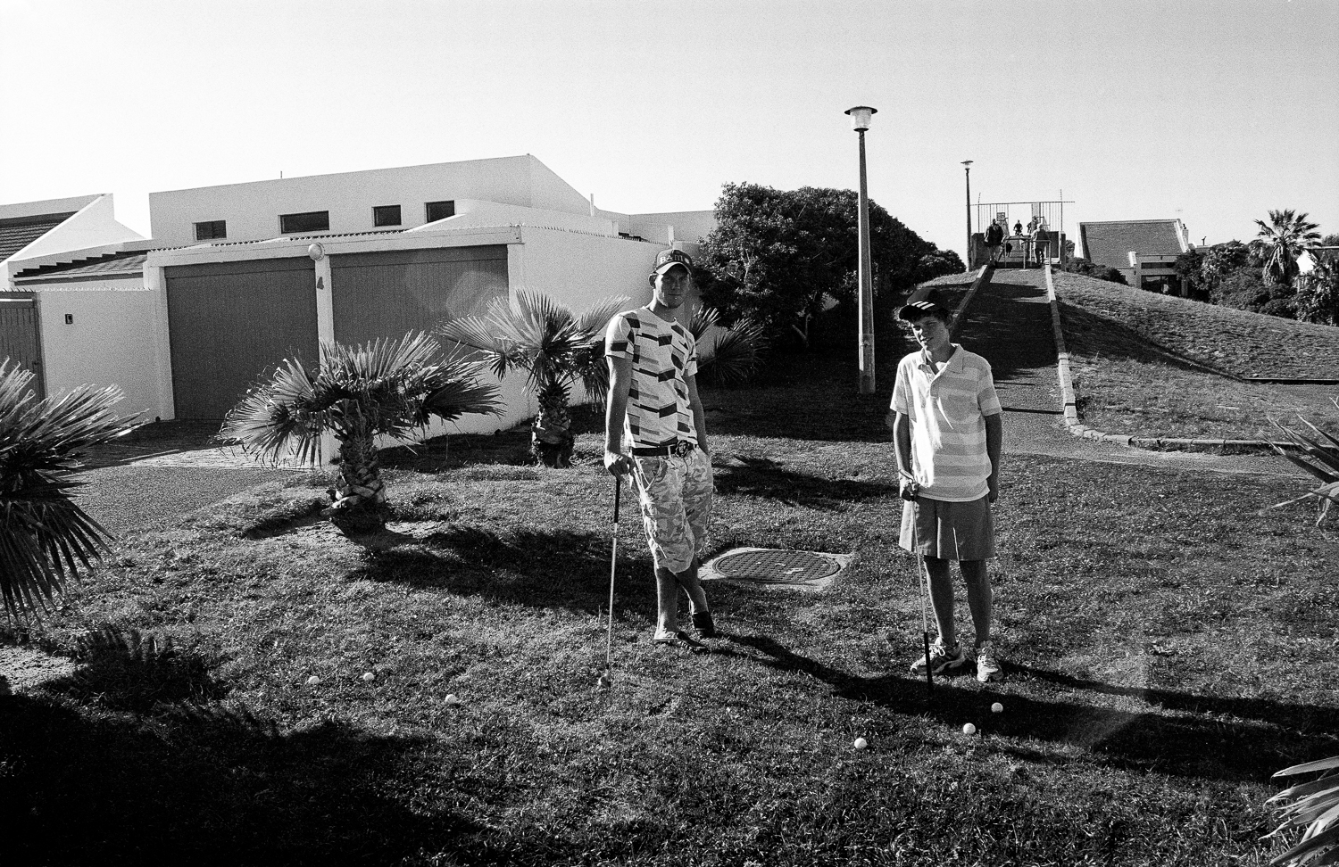 Teenagers playing golf, Marina da Gama, 2011.